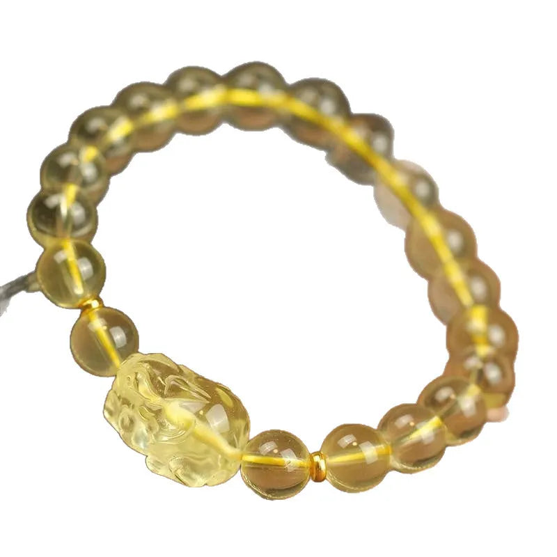 Yellow leather bracelet with a citrine-coloured artificial crystal Pi Xiu charm.