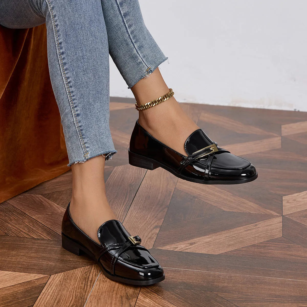 Patent leather square toe loafers in black with low heel and rubber sole