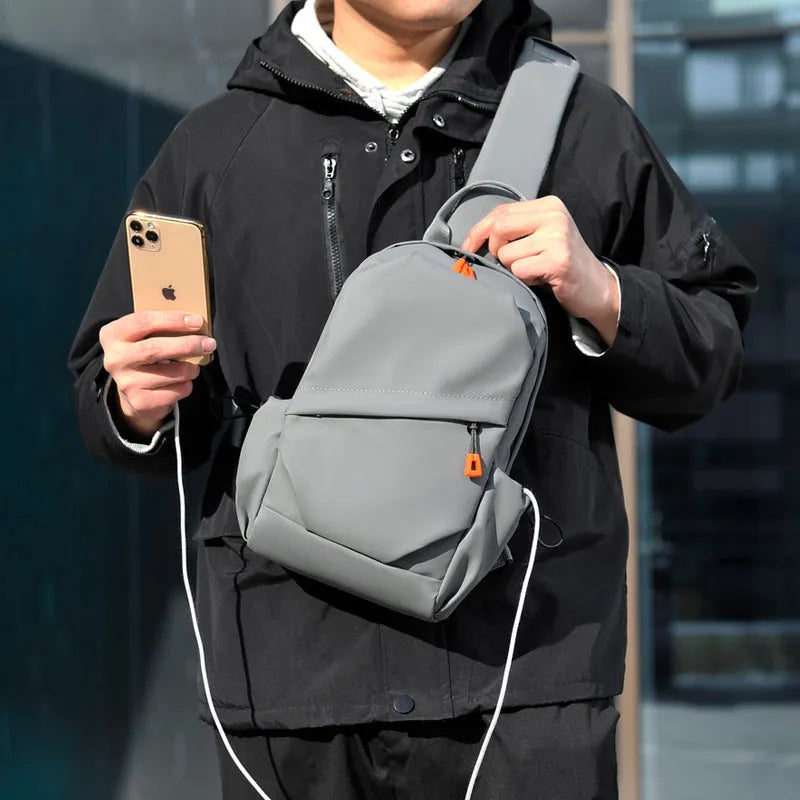 Black and grey mens casual single shoulder crossbody bag made of waterproof polyester.