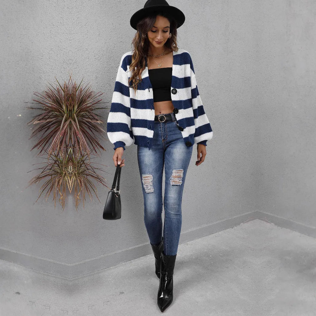 Blue and black striped women's cardigan sweater with button front and regular sleeves.