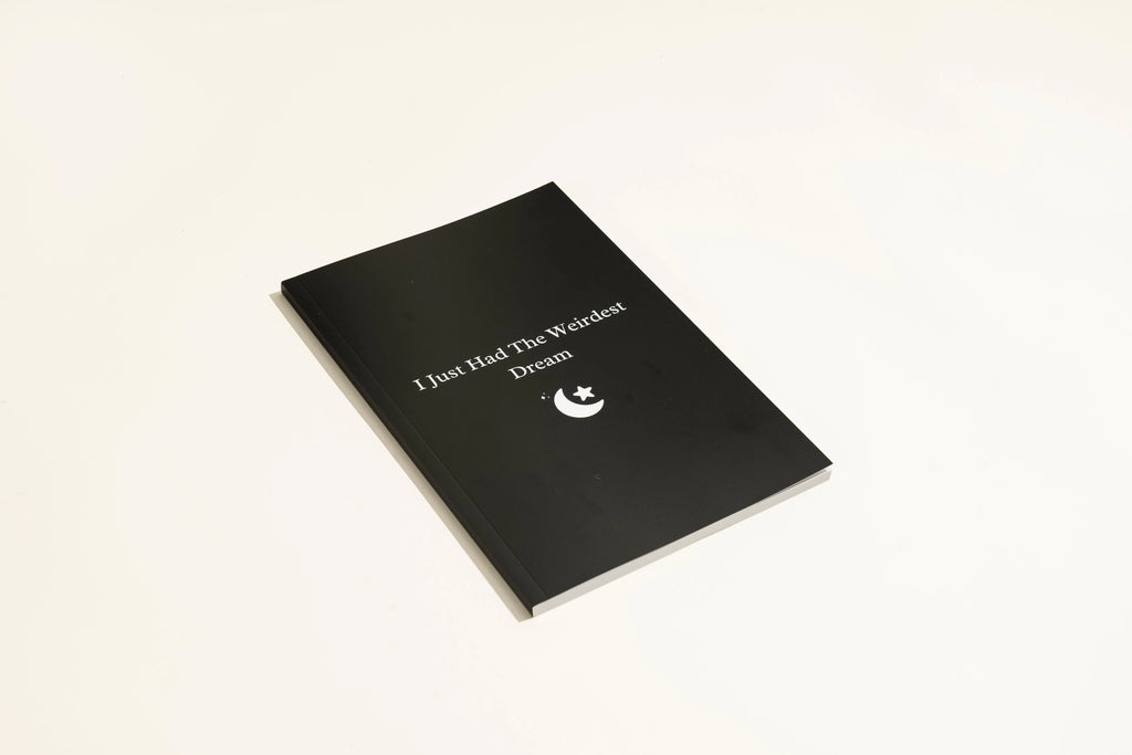 Black hardcover dream journal notebook with a business simplicity design for recording dreams.
