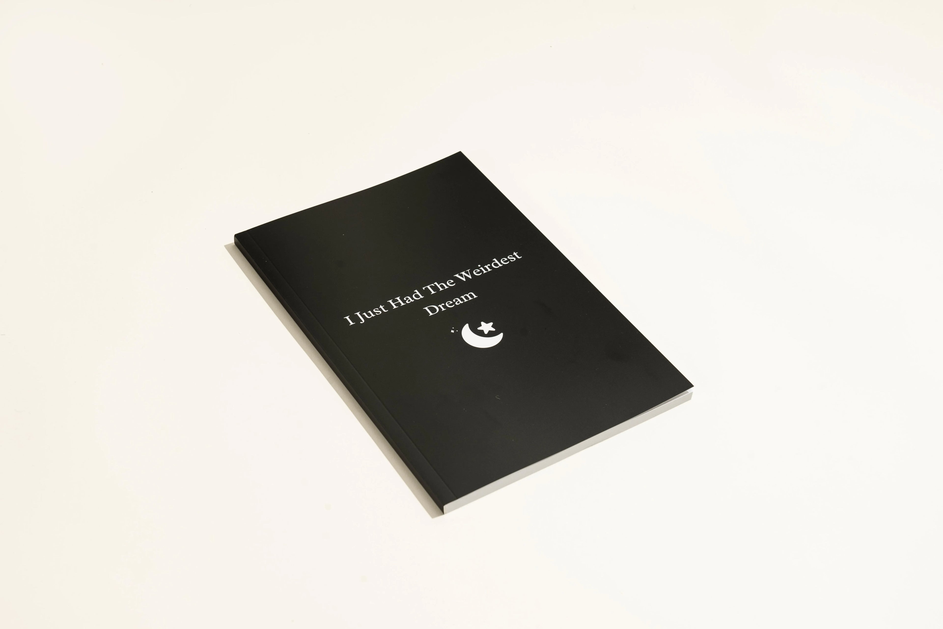 Black hardcover dream journal notebook with a business simplicity design for recording dreams.