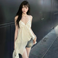 Apricot polyester sleeveless vest top with spaghetti straps, double-connector strap style, and asymmetric splicing detail.
