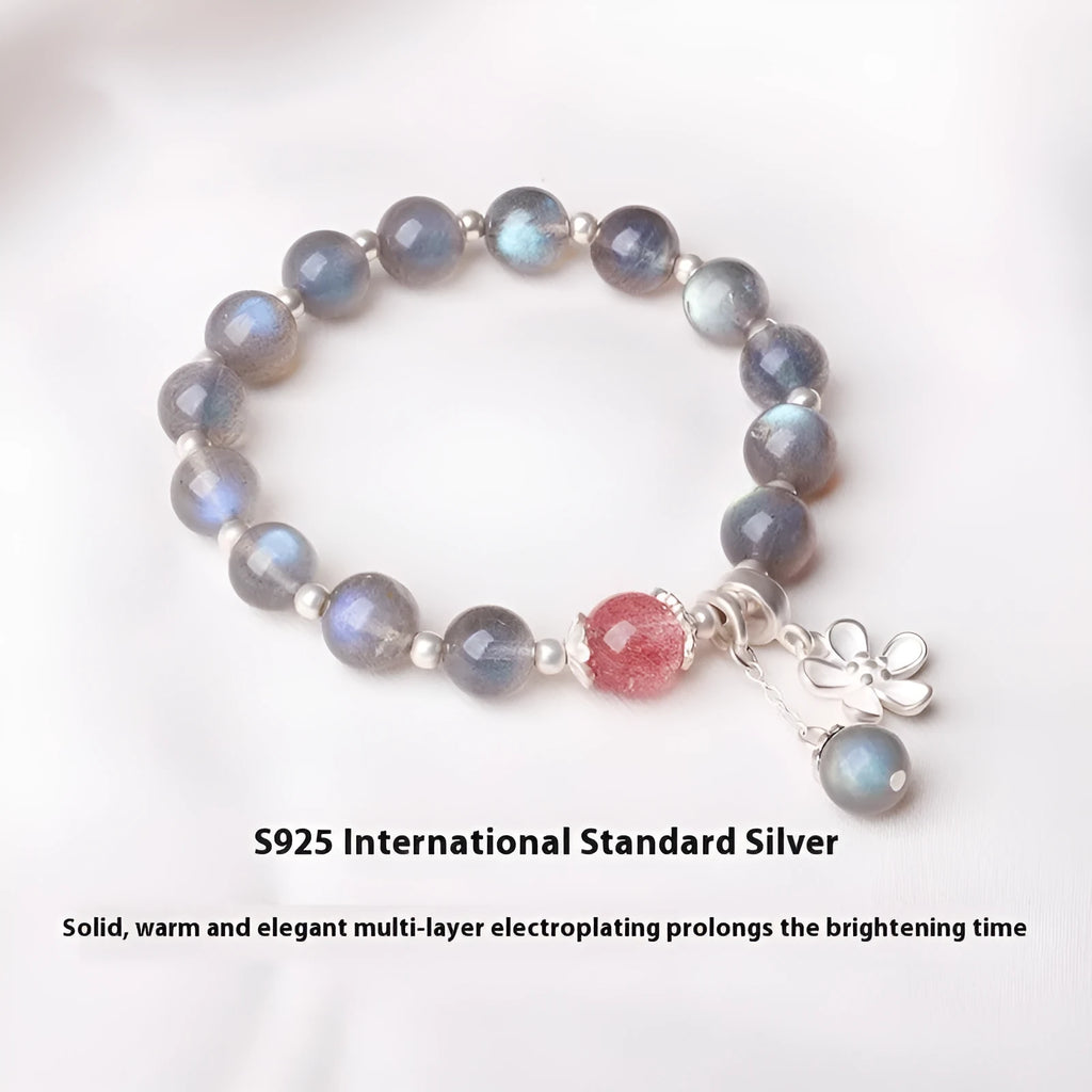 Women's silver bracelet with grey moonstone and zodiac charm.