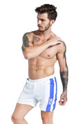 Men's slim-fit blue sports shorts with a lace-up front and supportive padding.