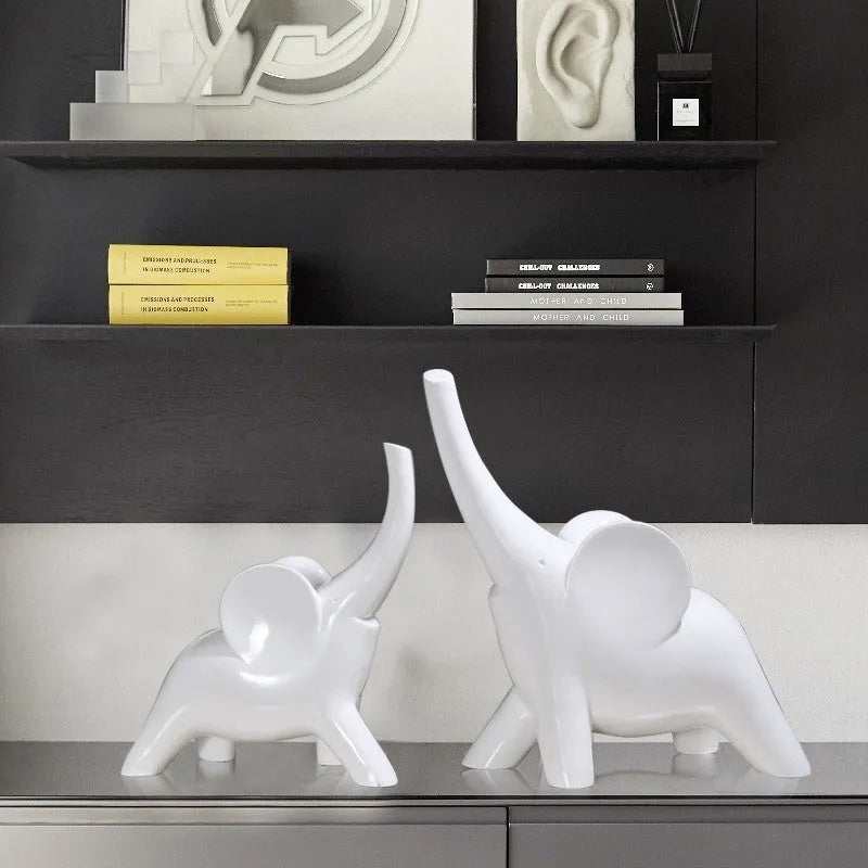 Modern resin and plastic elephant ornament in rose gold or white colour, available in large, small, or pair sizes.