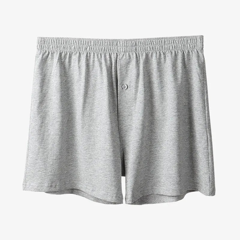Men's high-waist cotton boxer shorts in black, grey, and navy blue on a size chart