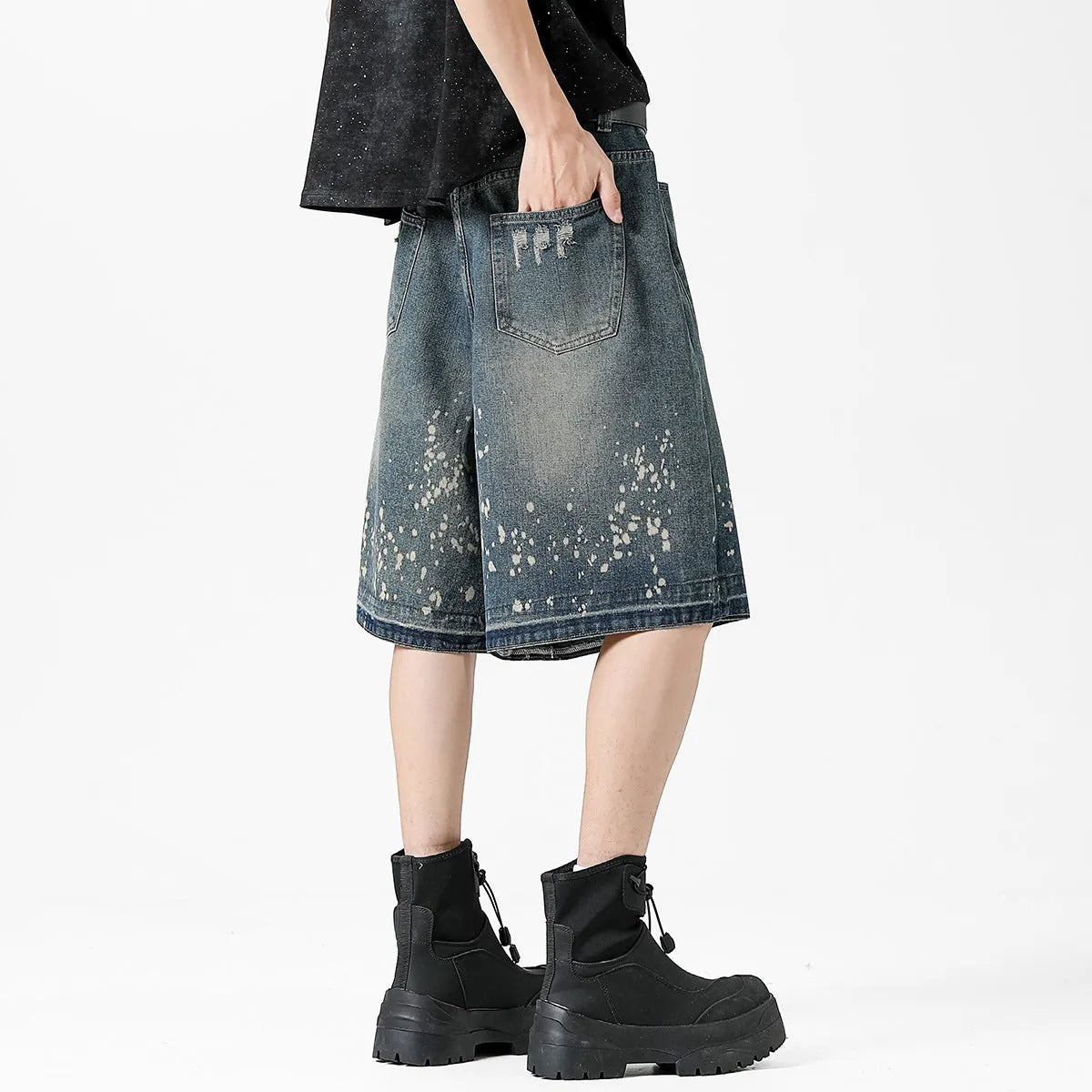 Men's retro blue denim shorts with washed finish and ripped knee detailing, straight leg cut