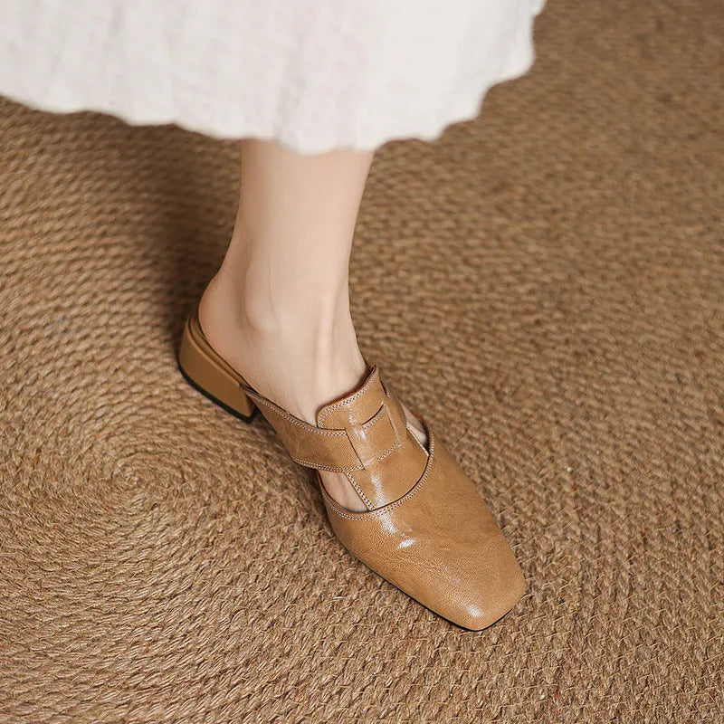 Retro closed toe low heel sandals in genuine leather, square toe, open back, apricot colour, on a neutral background