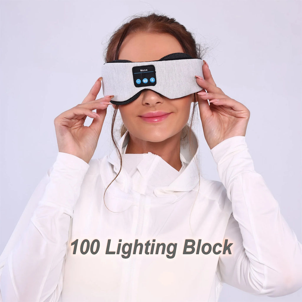 Grey polyester Bluetooth sleeping eye mask with long eyelashes design and no pressure fit.