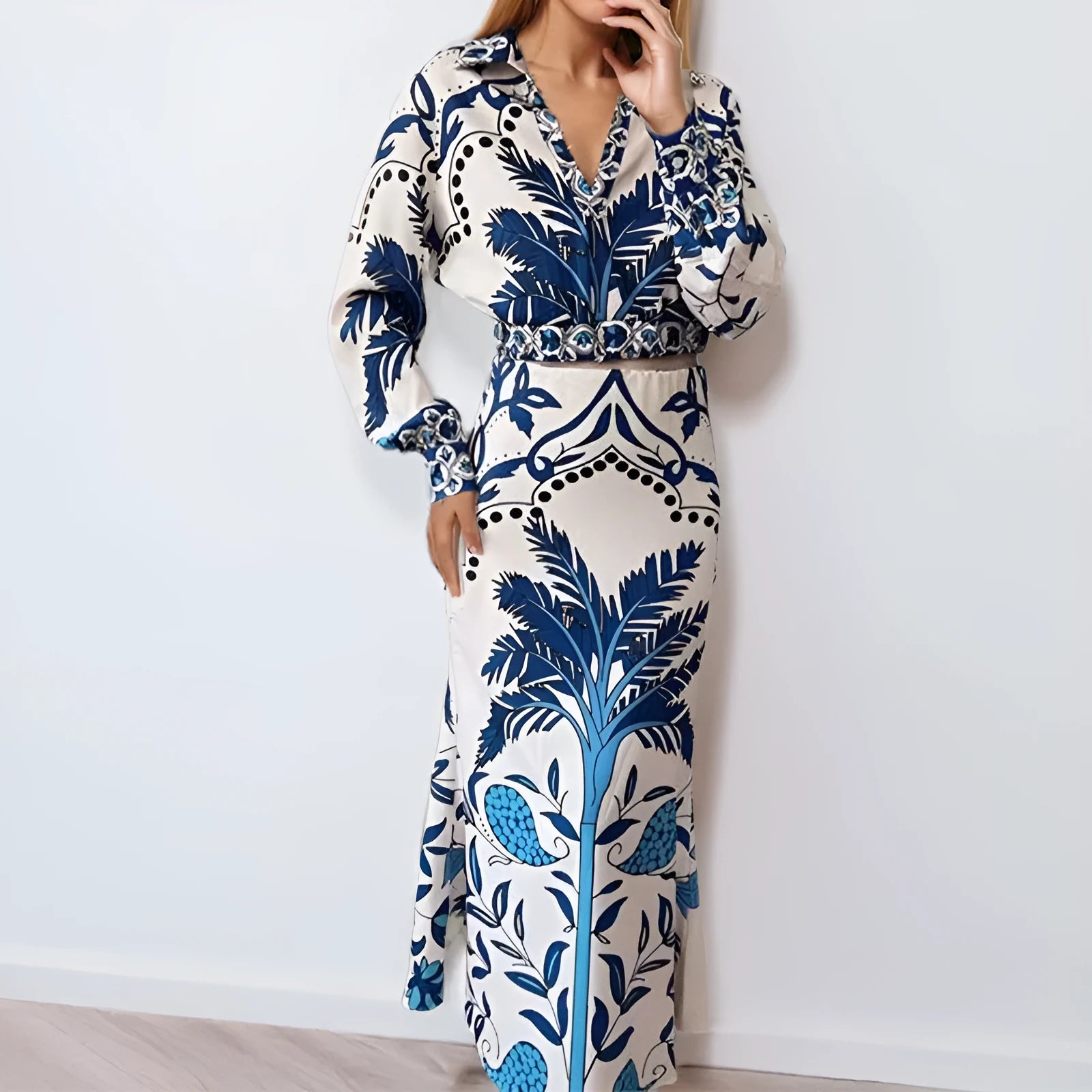 Women's floral print casual co-ord set with long sleeve top and long skirt on a hanger.