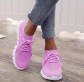 Ladies casual flat shoes in beige with breathable mesh upper, round toe, and front lace closure.
