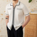 Slim black lapel collar short-sleeved polo shirt made from a thin viscose blend fabric.