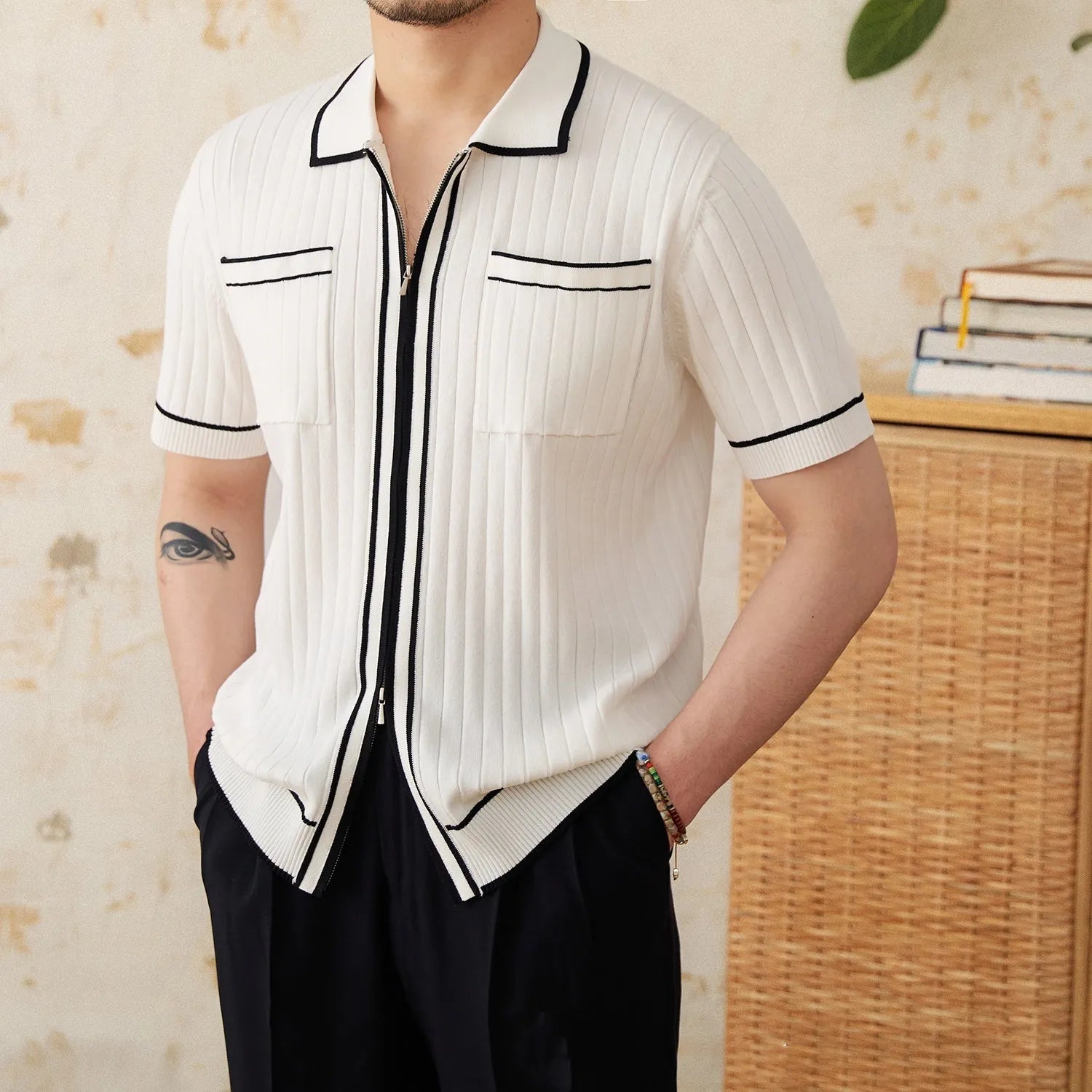Slim black lapel collar short-sleeved polo shirt made from a thin viscose blend fabric.