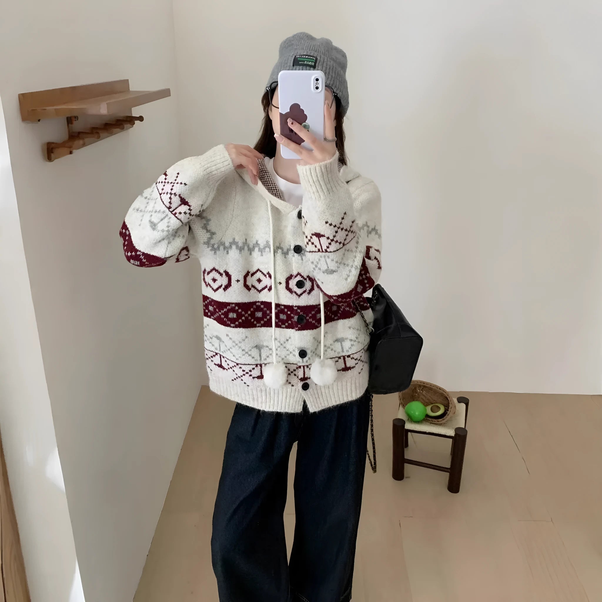 Plus size loose grey acrylic sweater coat with white geometric brocade pattern.