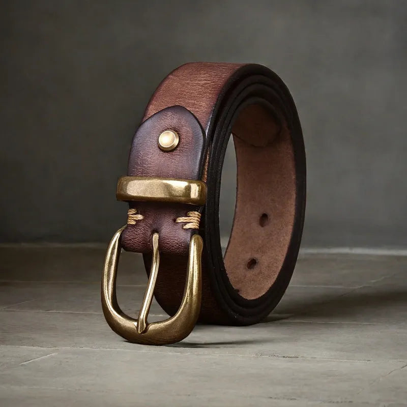 Men's brown cowhide leather casual belt with copper pin buckle on a flat surface
