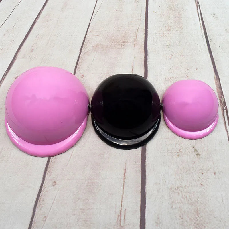 Plastic dog motorcycle helmet in various colours showing three size options