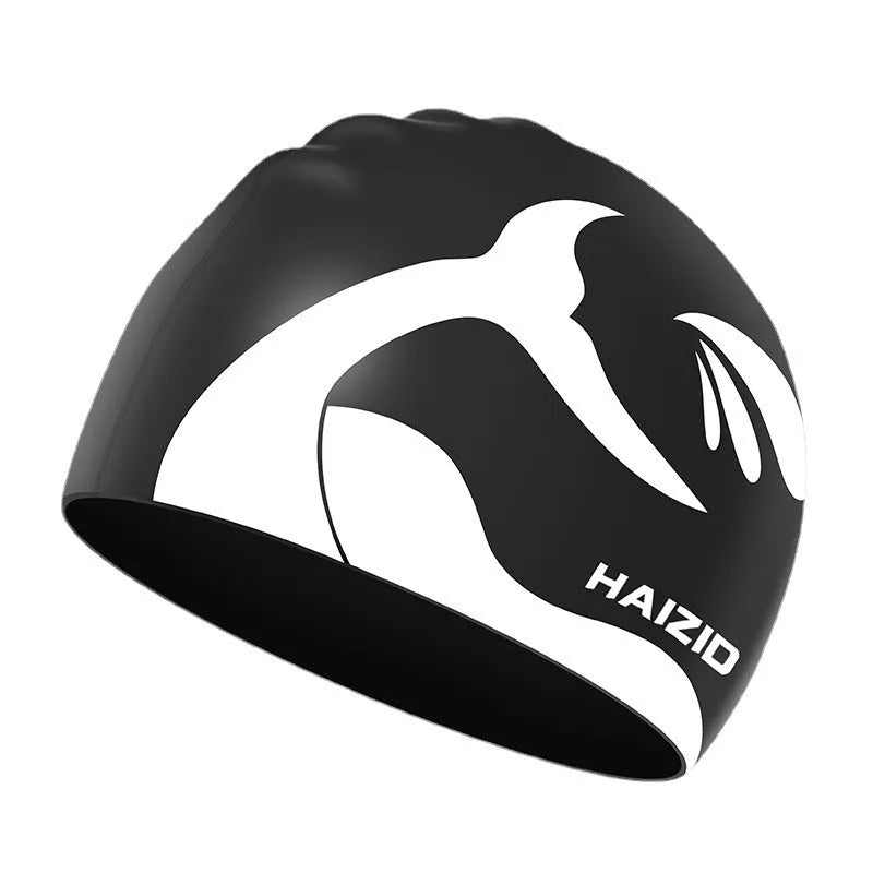 Silicone swimming cap with ear protectors in whale tail pattern, shown in black, blue, pink, and grey.