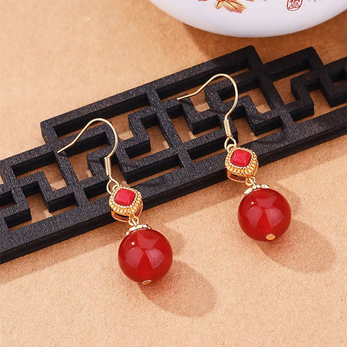 Geometric copper alloy earrings with round Southern red agate beads set in S925 silver.