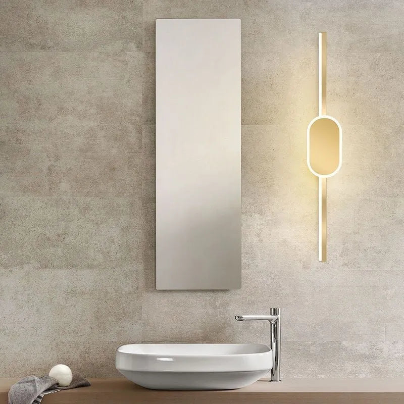 Gold-framed rectangular bathroom mirror cabinet with integrated LED light strip around the edge.