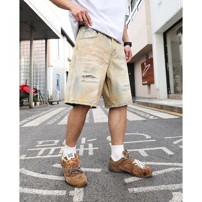 Men's light blue ripped denim shorts with washed old vintage styling