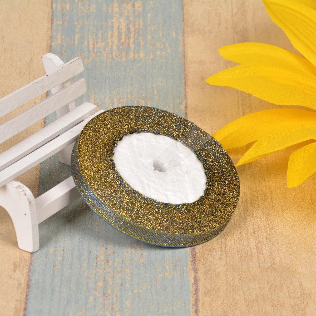 A roll of colourful green onion pattern polyester ribbon with metallic wire highlights, shown at 3-points width.
