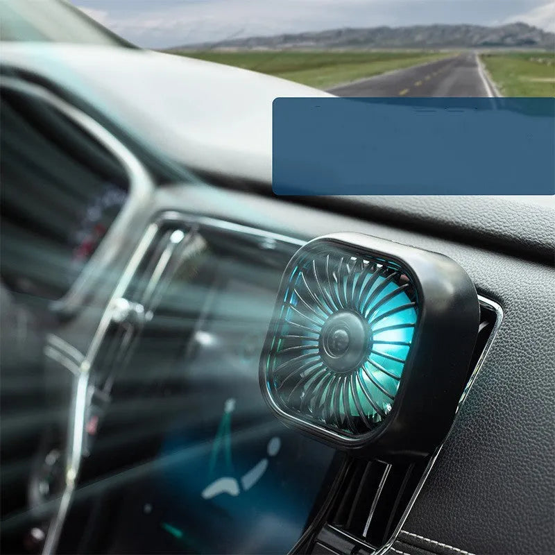 Compact USB car fan with three-speed buttons in black colour on vehicle dashboard