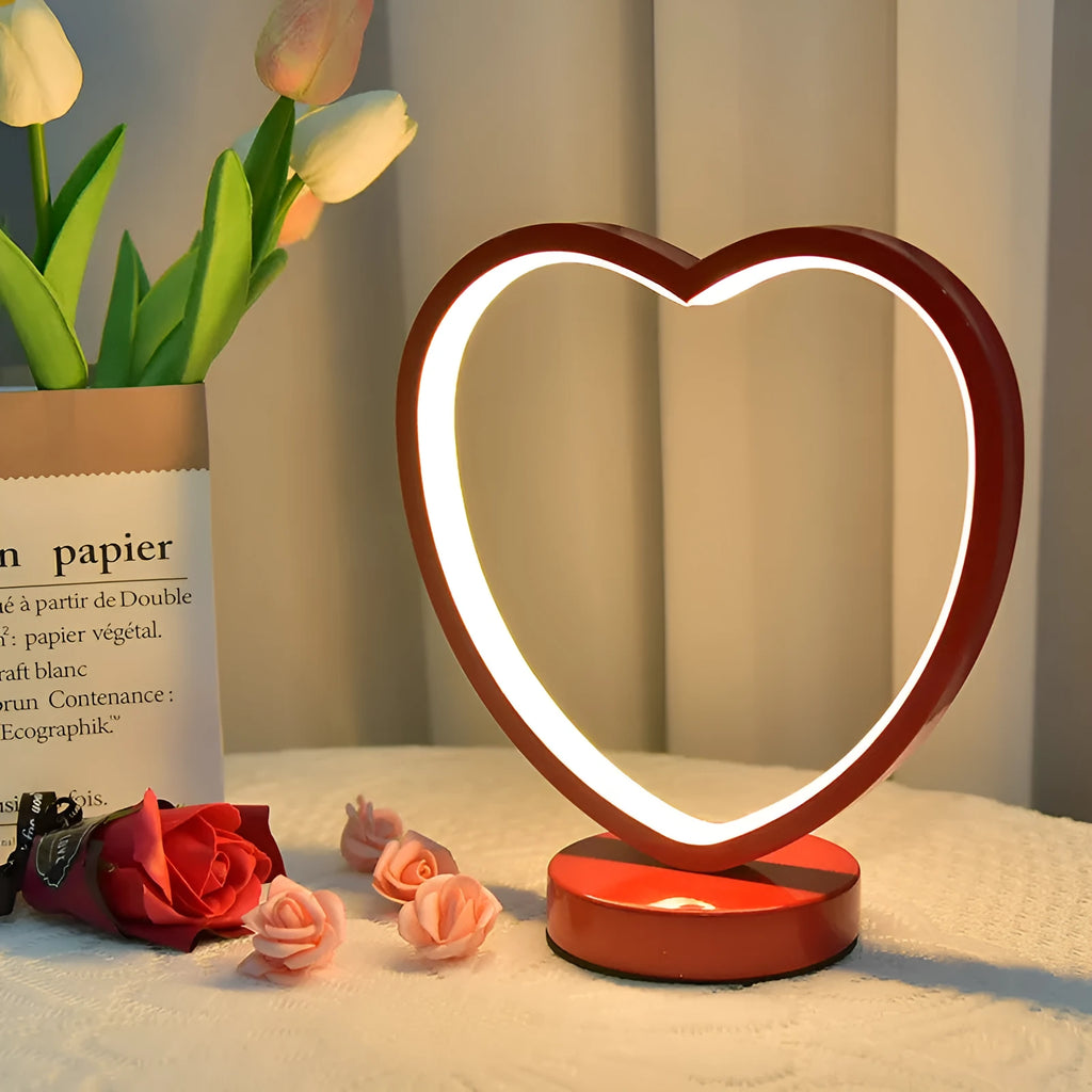 Creative red wedding lantern USB table lamp with warm light and red heart ring design on a tabletop