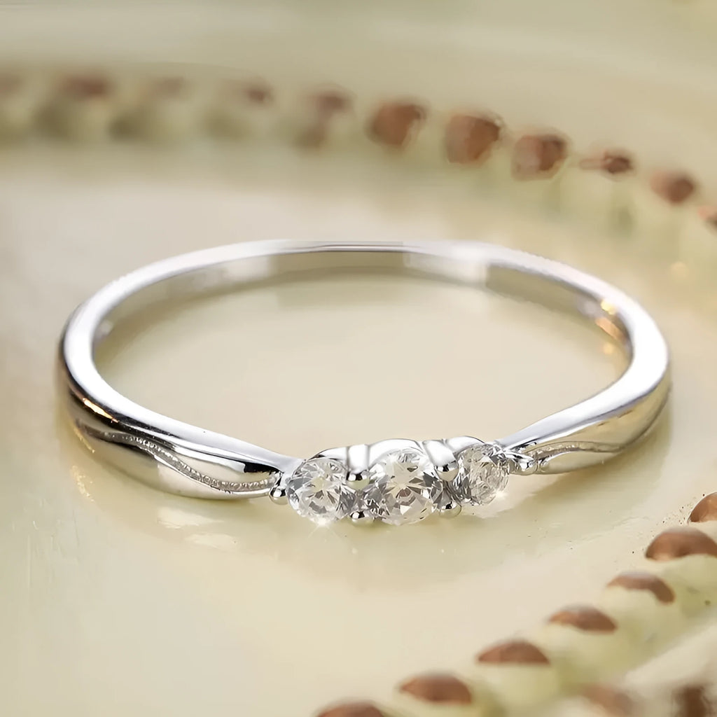 S925 sterling silver ripple wave ring with white gold electroplated finish on white background