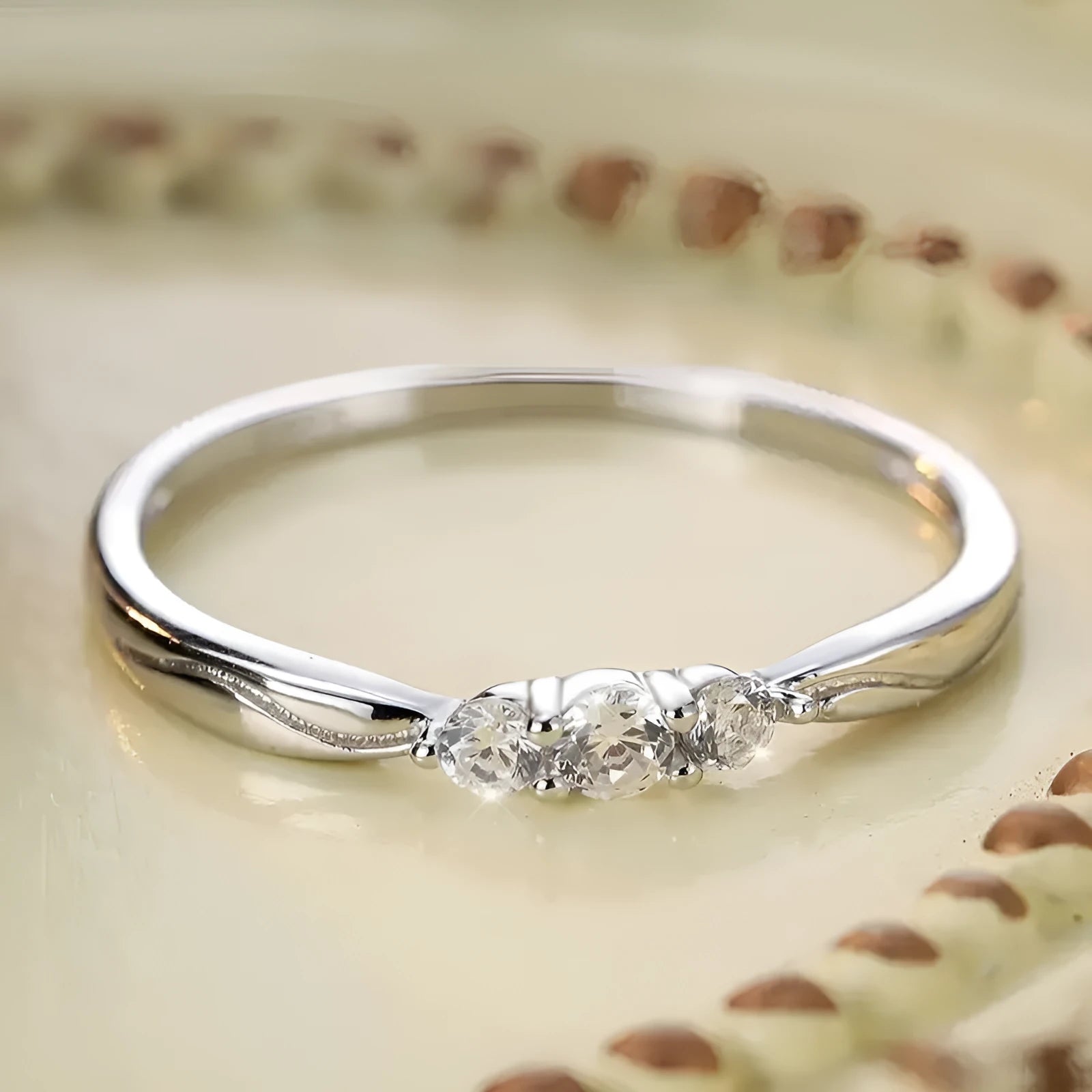 S925 sterling silver ripple wave ring with white gold electroplated finish on white background