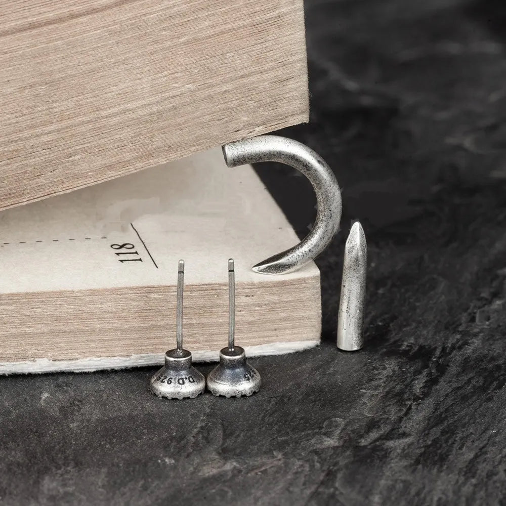 S925 sterling silver punk nail stud earring on ear hook, shown in straight and curved nail styles.