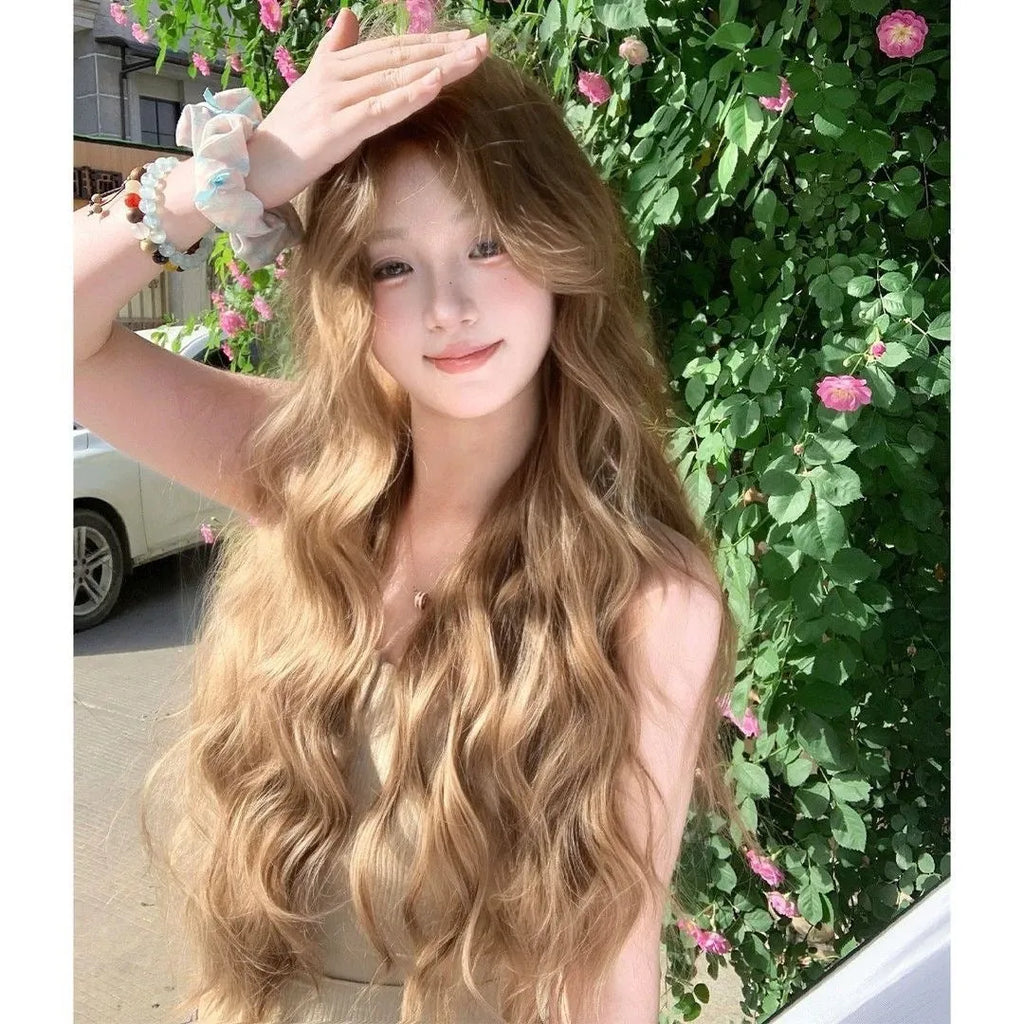 Linen brown medium-long curly synthetic wig on display stand with hair net