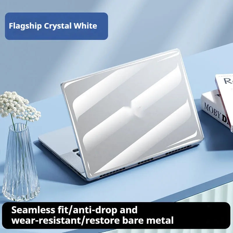 Clear transparent plastic protective shell case for a MacBook Air or Pro laptop on a table.