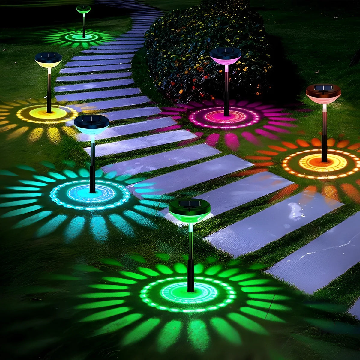 Solar garden light water droplet projection on lawn with colourful LED glow