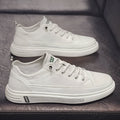 Men's white casual PU shoes with round toe and low flat heel on a plain background.