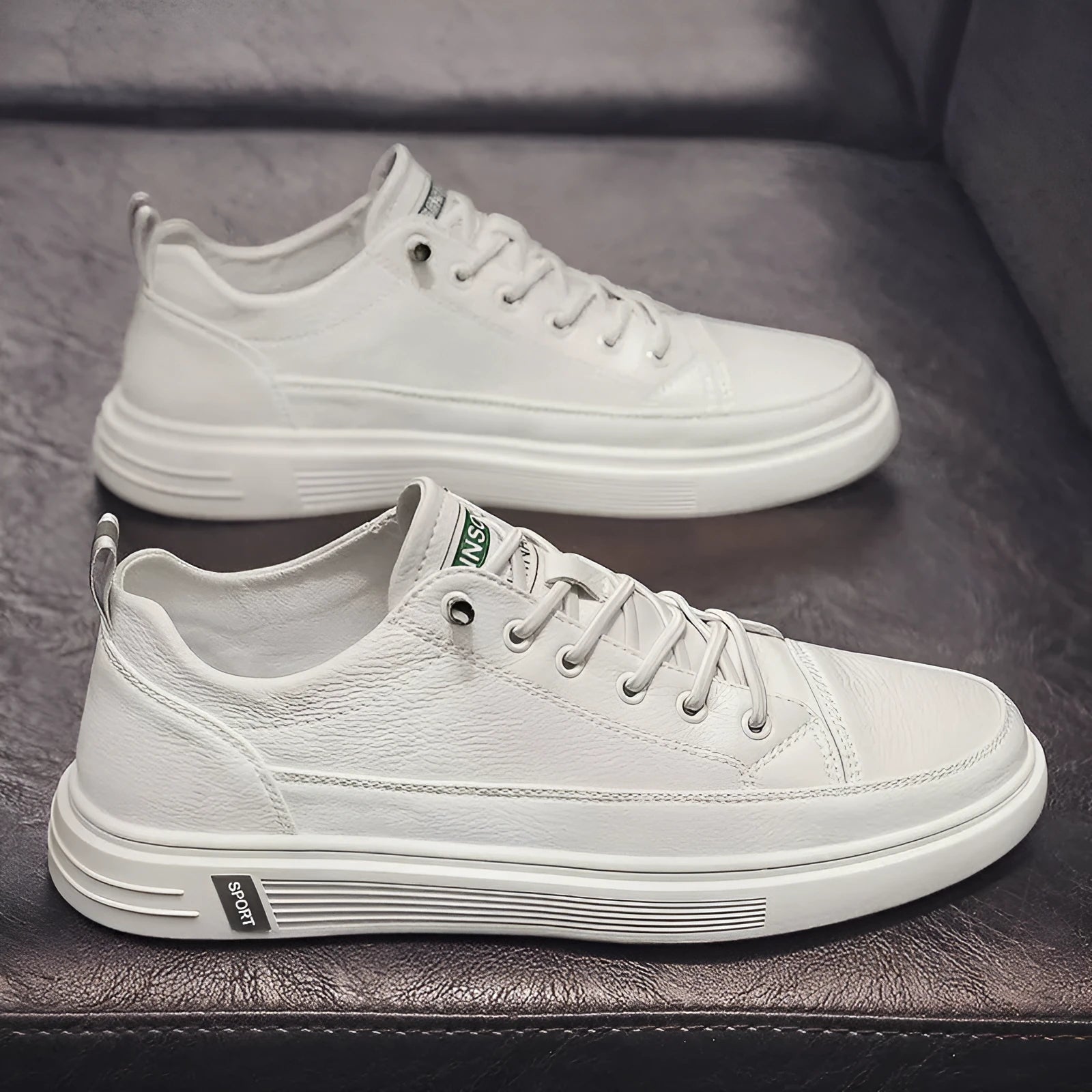 Men's white casual PU shoes with round toe and low flat heel on a plain background.