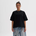 Pure cotton loose fit t-shirt in apricot colour on a hanger