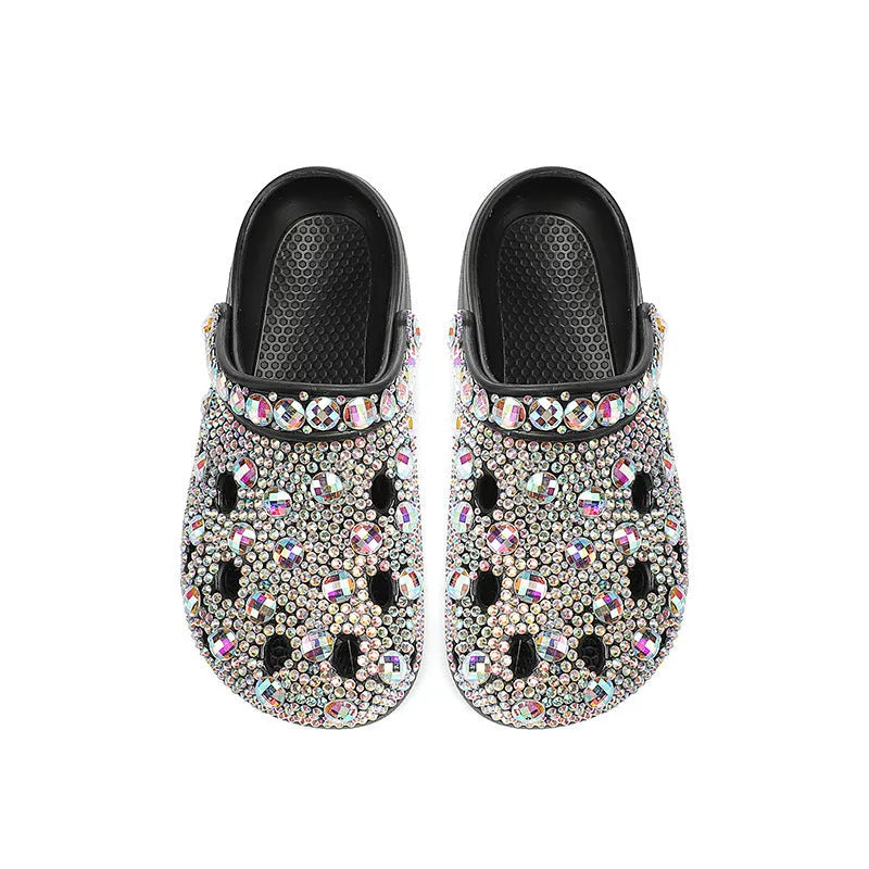 Black women's platform sandals with rhinestone detail and an open hole design on the EVA upper.