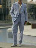Blue and white striped polyester blazer and trousers suit set on a hanger