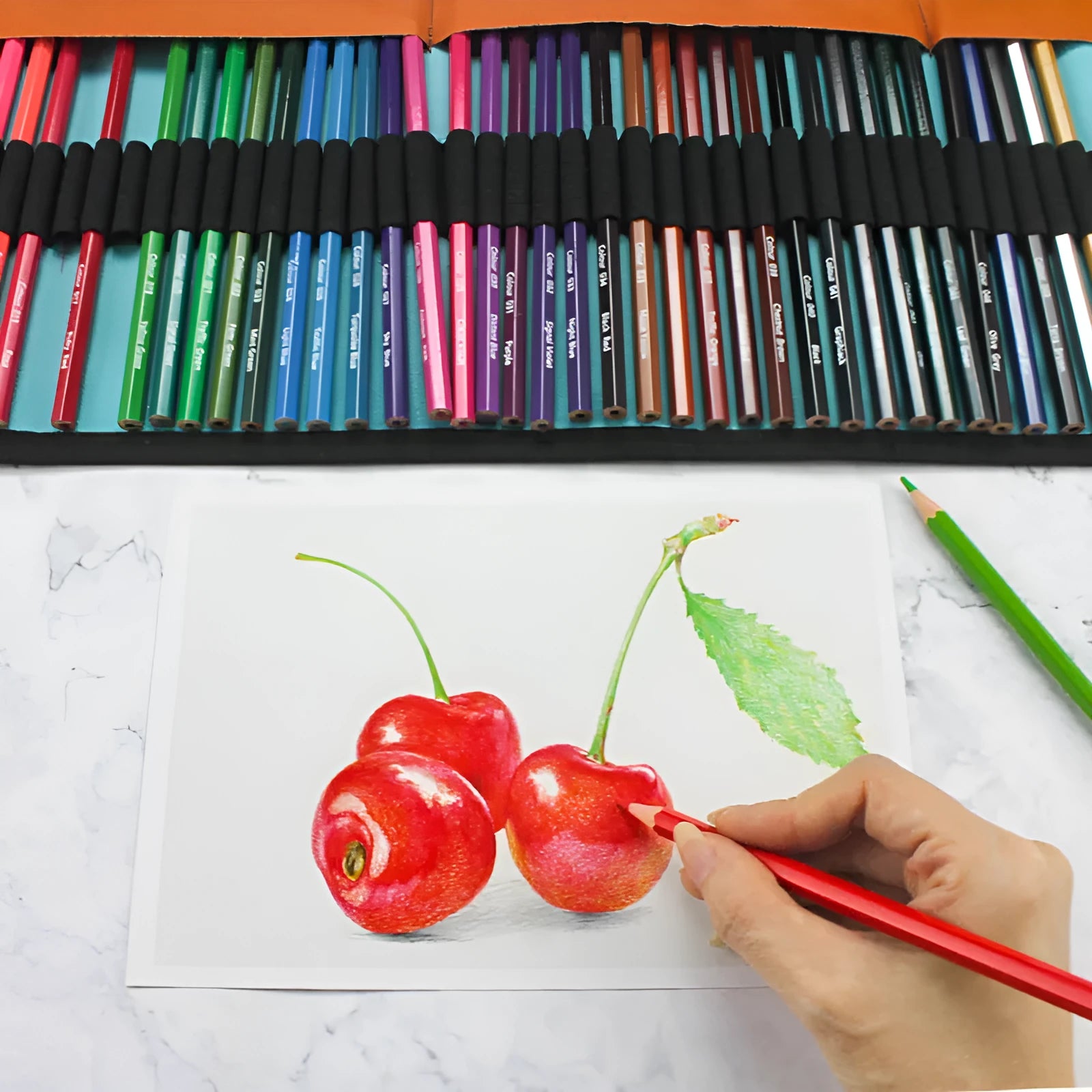 Set of 50 coloured wooden pencils in a variety of colours, presented in a brown wooden storage case.