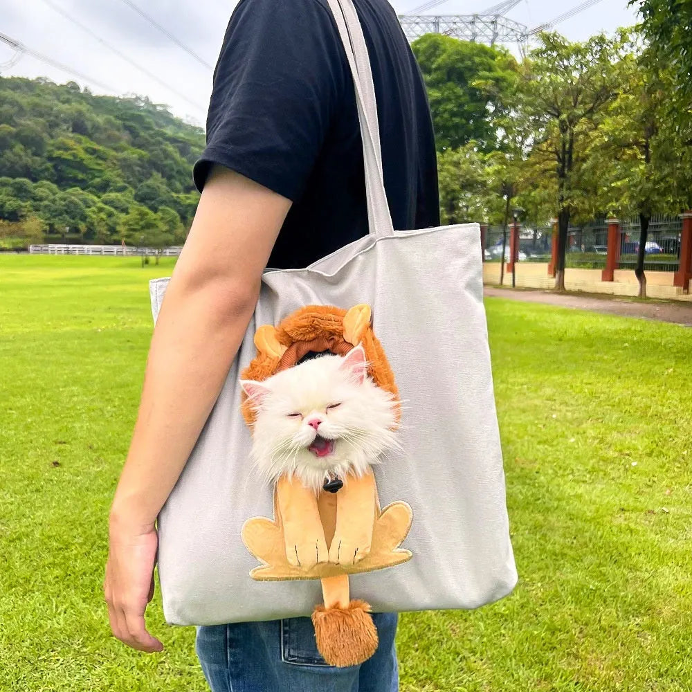 Canvas pet carrier shoulder backpack with cartoon pattern for small dog or cat transport.