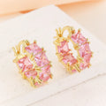 Geometric U-shaped women's earrings with zirconium stones and gold-plated copper construction