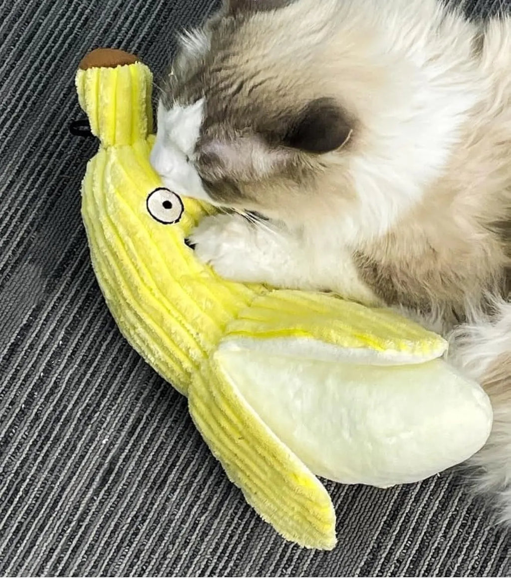 Yellow banana-shaped cat toy with crinkle paper and plush fabric for chewing and kicking