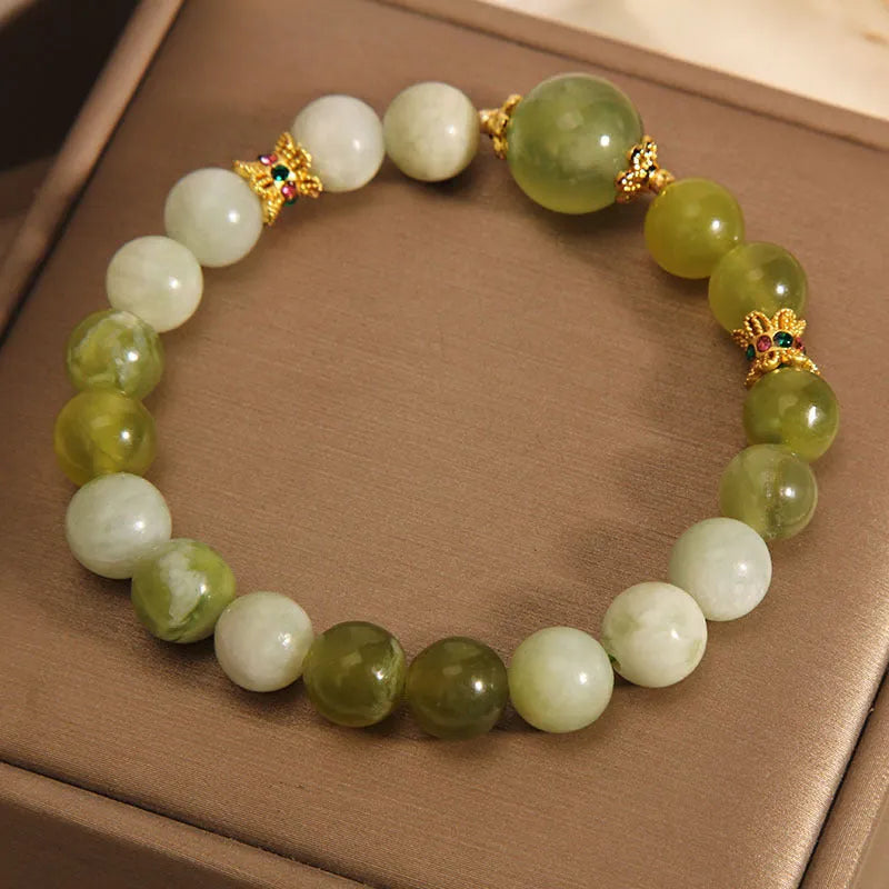 Women's Xiuyan jade bracelet in jade green with an original sweet mori style design.
