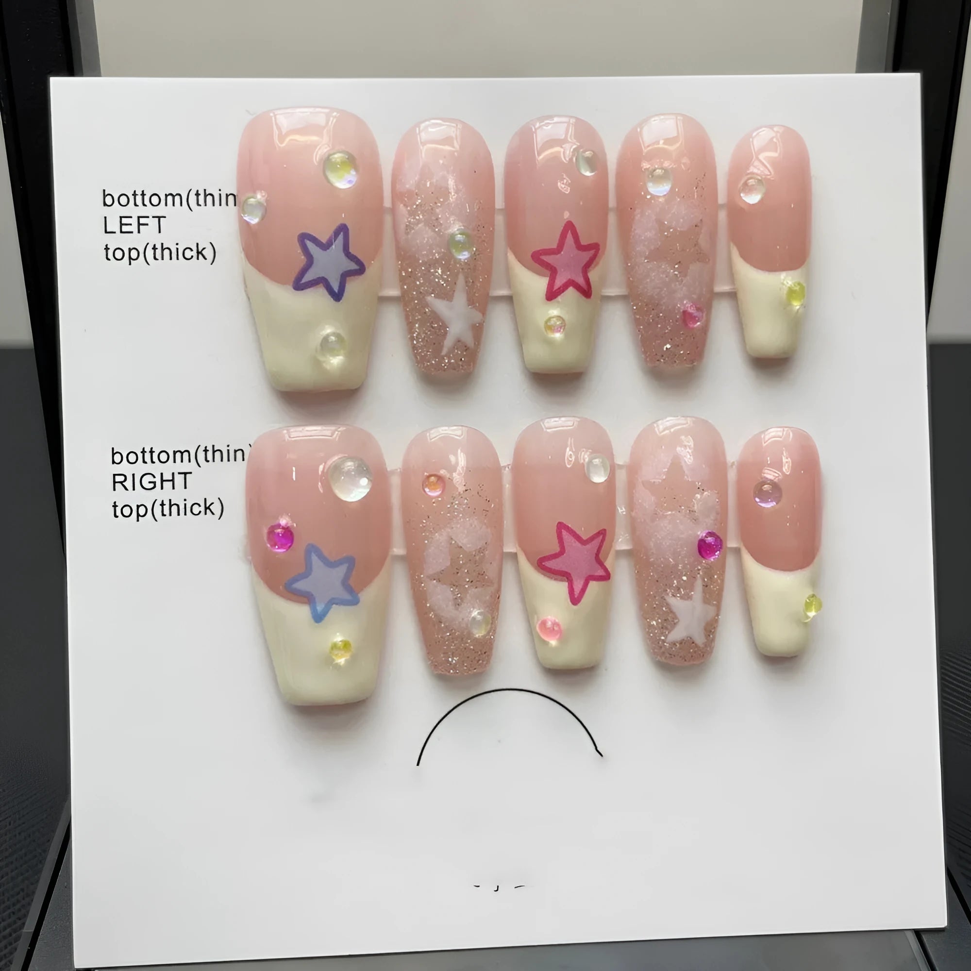 Handmade Sweet Star ladder pattern press-on nails in ultra-thin seamless style on a flat surface with glue and nail file
