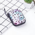 Tinplate coin purse with anime cartoon pattern, letter details, horizontal square shape, and zipper opening.