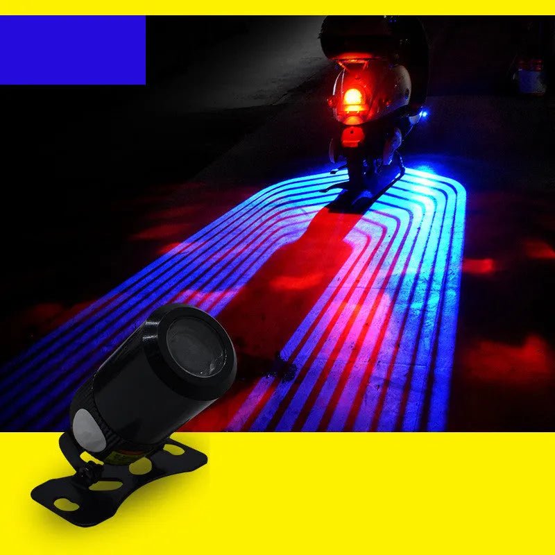 Wings projection LED lamp with aluminium housing and projection lens, for motorcycles and vehicles, available in blue, ice blue, red, or white.