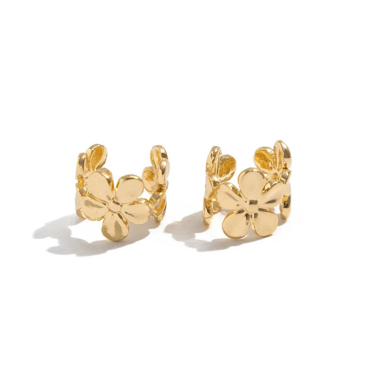 Gold-coloured alloy earrings with starfish and scallop shell designs.