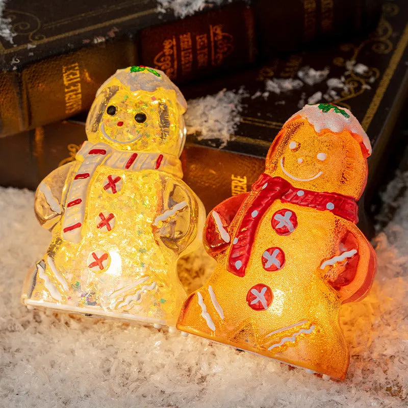 Glowing plastic gingerbread man Christmas ornament with red scarf, showing modern design and compact size.