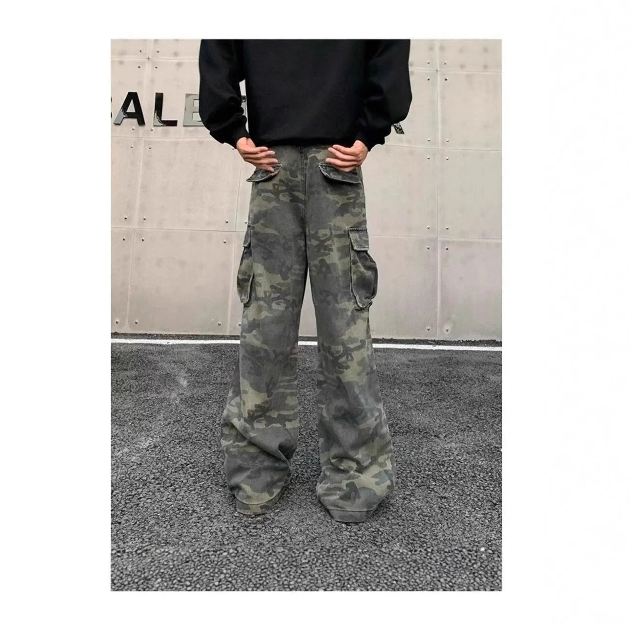 Vintage washed camouflage pattern cargo trousers with multiple pockets on a mid-waist fit.